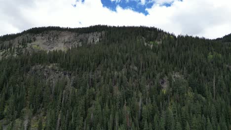 Towering-Mountain-Covered-in-Dense-Trees