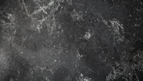 mármol negro giratorio con textura de fondo de vetas grises