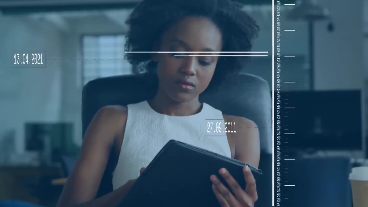 Animation of data processing over african american businesswoman using digital tablet at office