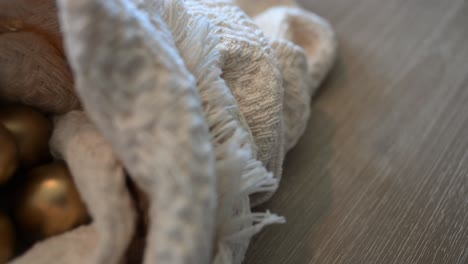 golden eggs nestled in cream fabric