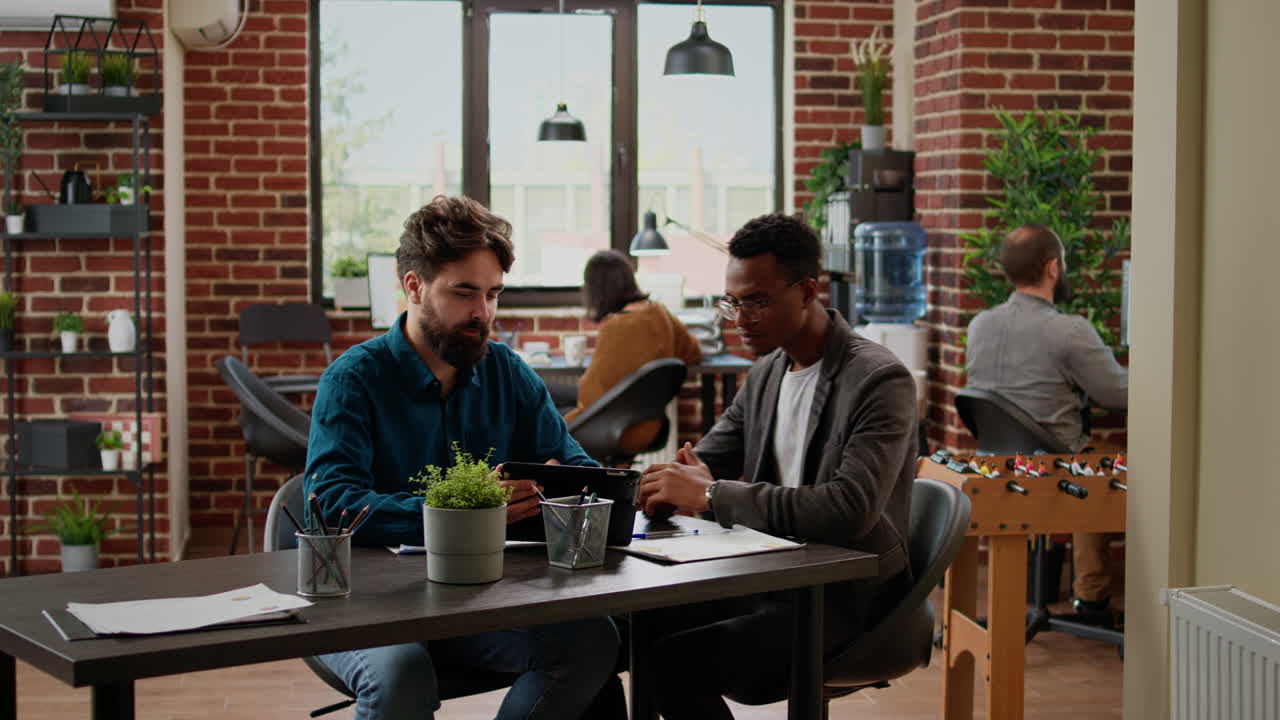 Multiethnic team of people brainstorming ideas to plan report