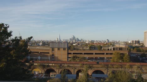 view of office buildings and skyline of city of london from peckham in south london uk