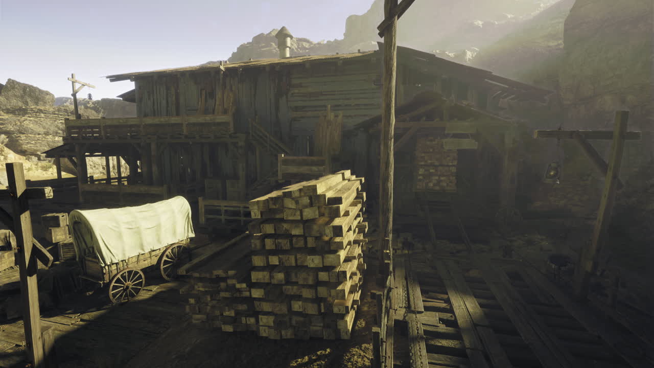 Old wooden structure with stacked timber and wagon in a rustic setting