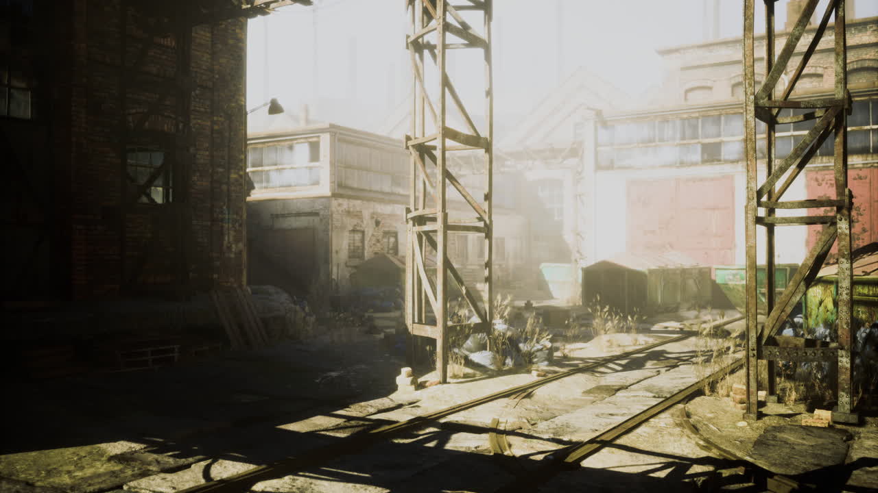 Abandoned industrial site with overgrown vegetation and sunlight at dawn