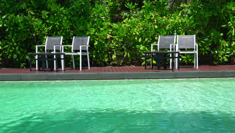 empty-chair-around-swimming-pool