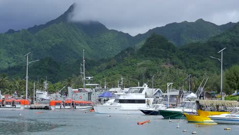 slow-motion fishing boats and trawlers dock harbour in tropical cook islands rarotonga with mountains in background landscape 1920x1080 hd