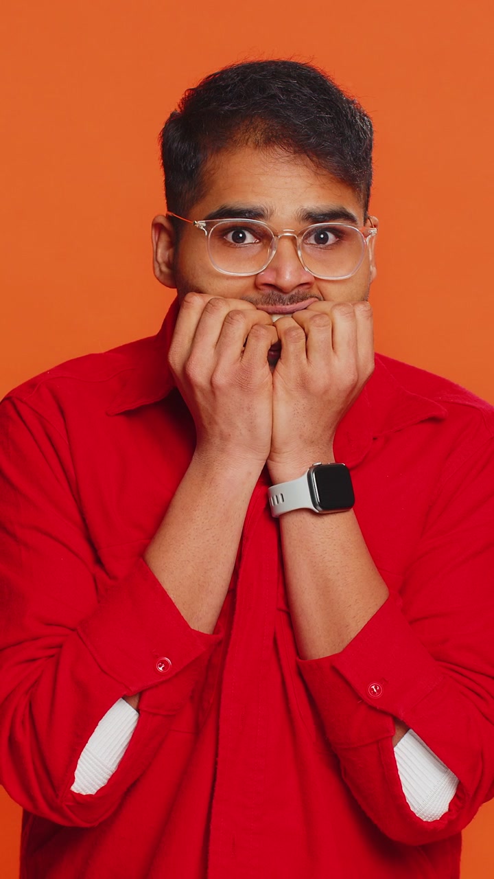 Scared fearful depressed indian man suffering phobia anxiety disorder expresses fear stress panic