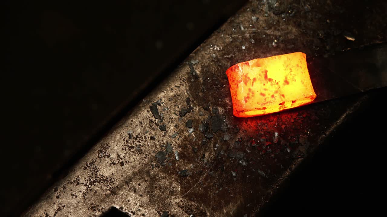 Close-up of blacksmith working on a iron rod