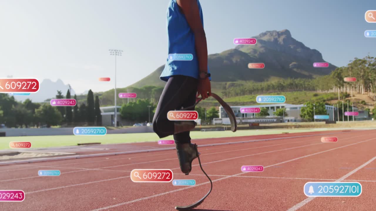 Animation of notifications over african american man with prosthetic legs jumping on running track