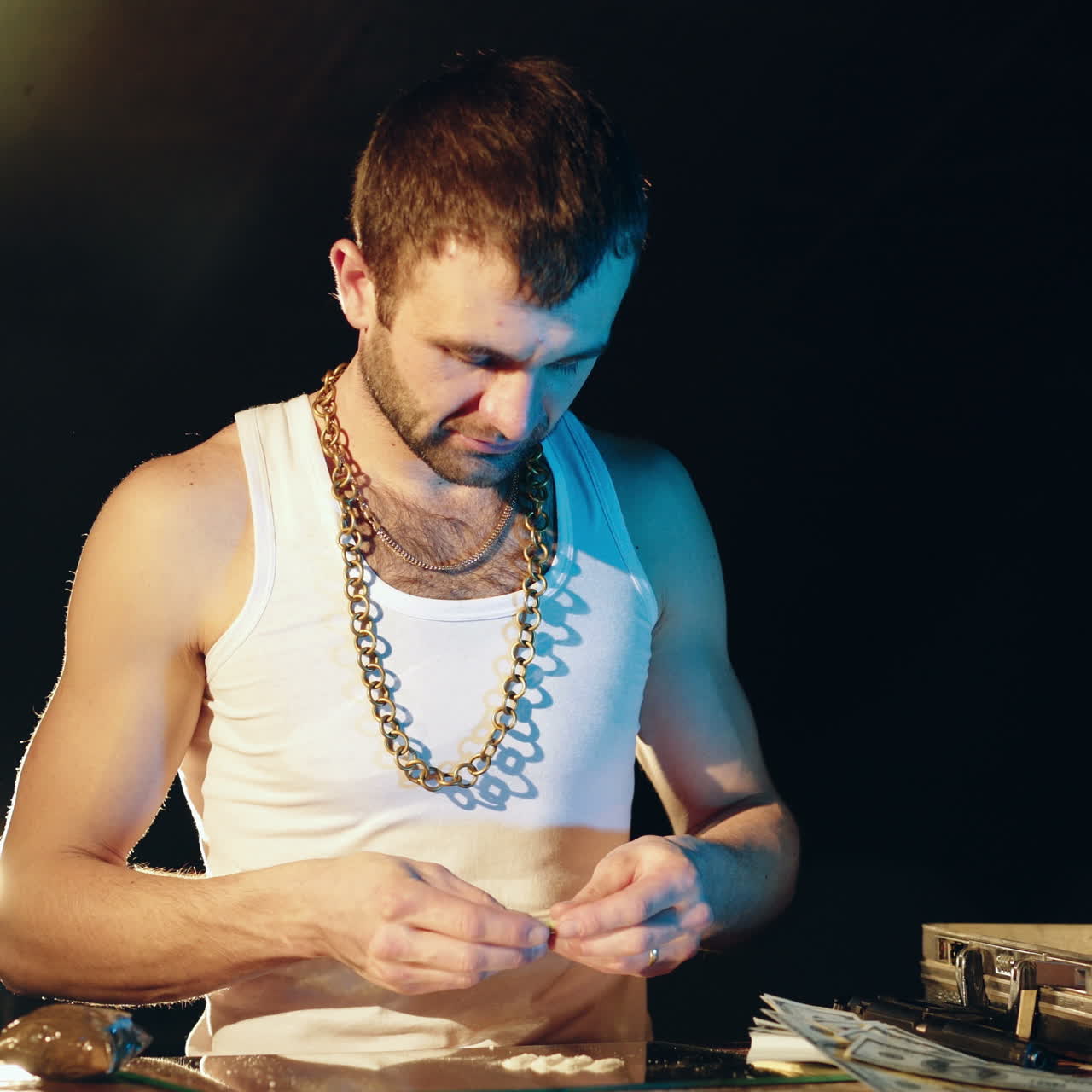 Young man sniffing cocaine on a mirror with a roll of banknotes. Abuse of drugs. Criminal business Square video