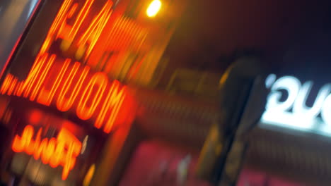 Illuminated-banners-in-night-street-defocus