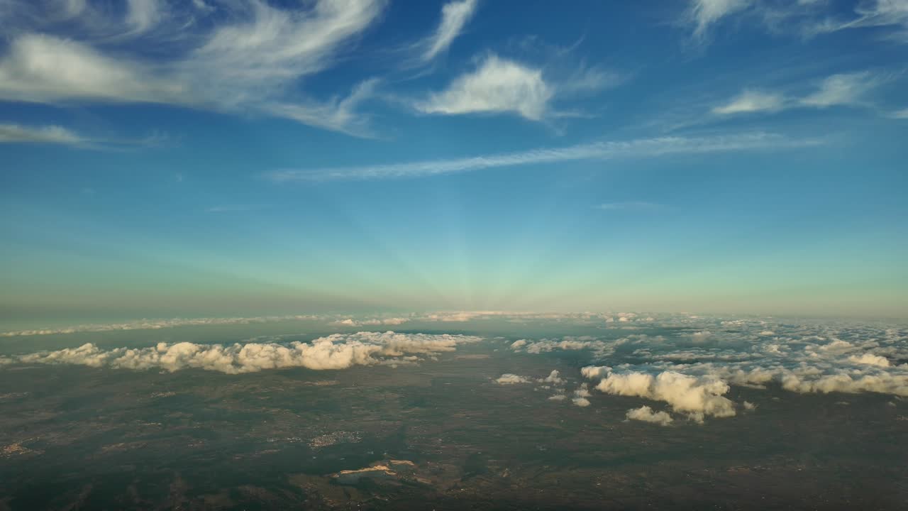 Quiet winter sky at sunset, a pilot&rsquo;s perspective shot from an airplane cabin fliying over Mallorca Island, Spain, at 4000m high