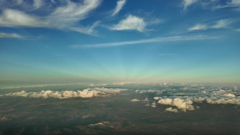 Quiet winter sky at sunset, a pilot&rsquo;s perspective shot from an airplane cabin fliying over Mallorca Island, Spain, at 4000m high
