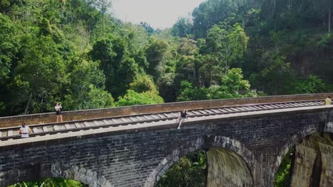 girl sitting on the edge of a beautiful bridge - freedome