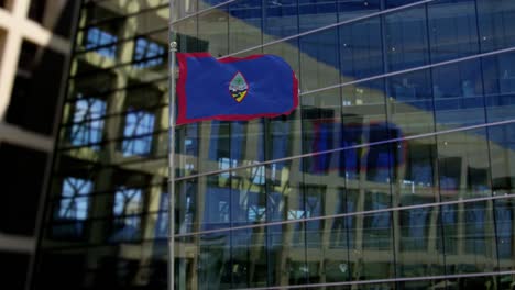 guam flag waving on a skyscraper building