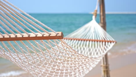 empty hammock on beach. focus on foreground