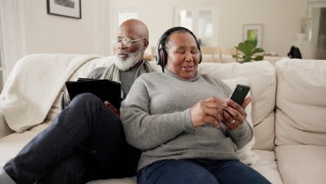 Senior-couple,-phone-and-laptop-with-headphones