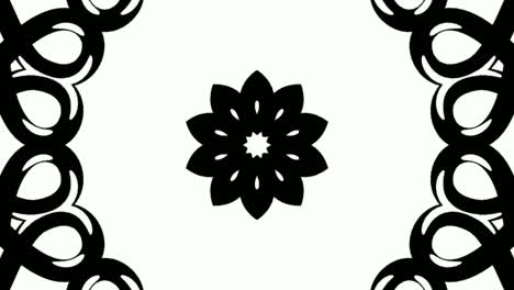 modello di mandala bianco e nero disegnato verso l'interno, grafico