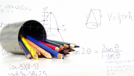 Animation-of-mathematical-equations-floating-over-colored-pencils-against-white-background