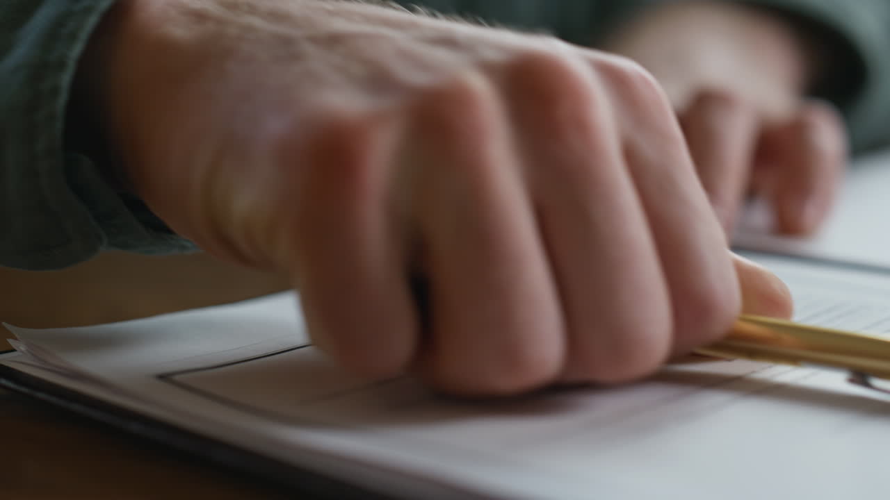 Businessman hands signing agreement at desk closeup. Man ceo writing signature