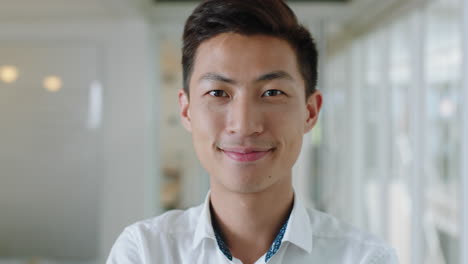 portrait young asian businessman smiling enjoying successful career proud entrepreneur in office workplace testimonial 4k footage