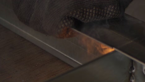 welder works in metal construction - construction and processing of steel components, slow motion