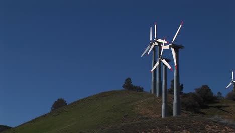 longshot of four turbines generating power at tehachapi california