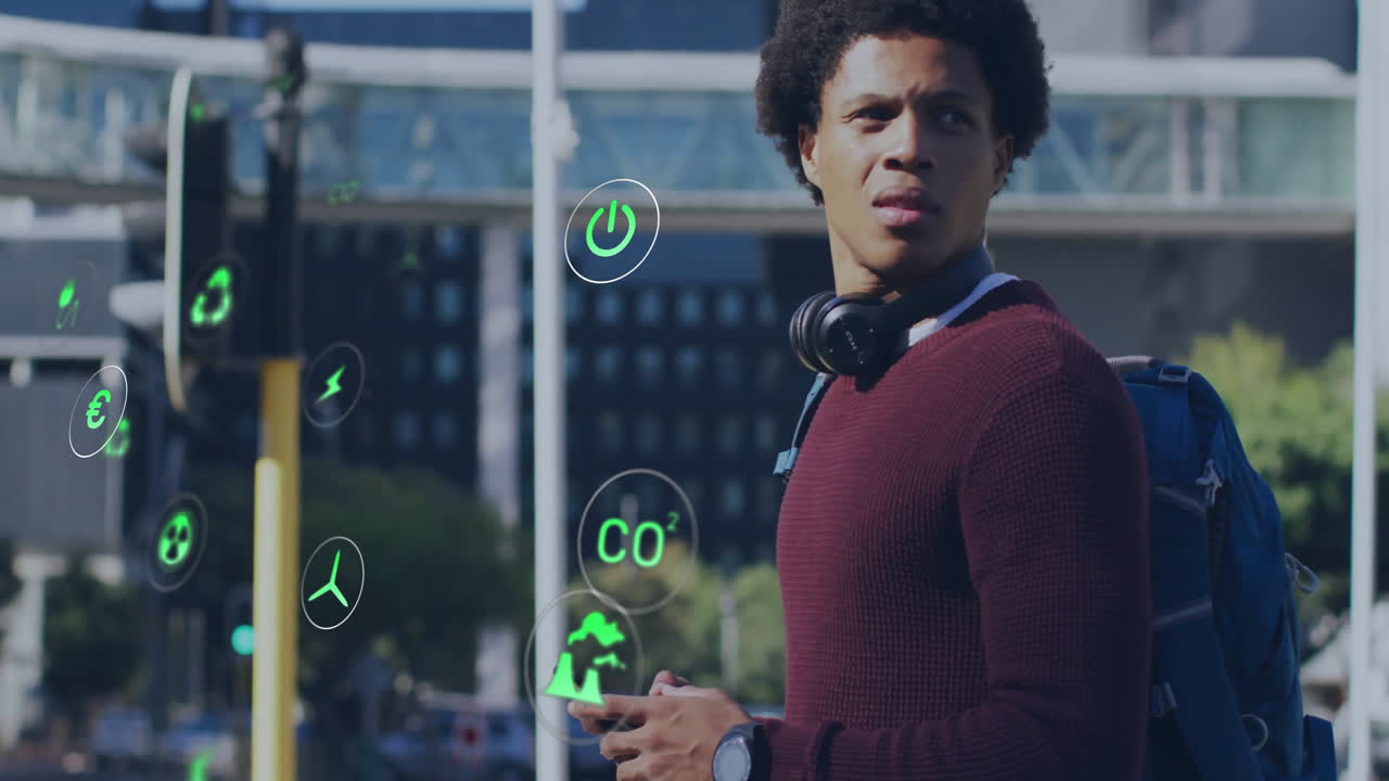 Man scanning smartphone at urban intersection, displaying floating green environmental icons