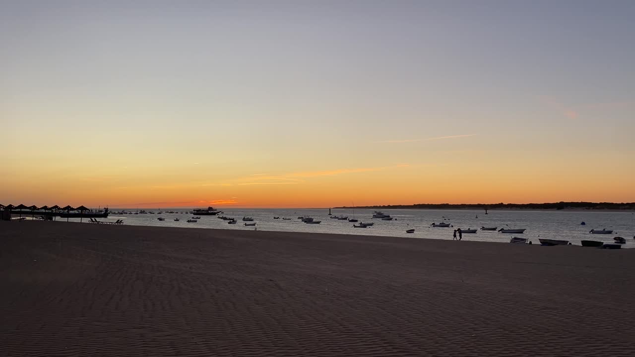 sanlucar de barradema, cadiz, guadalquivir ,rio, doñana, españa, Boats anchored in a calm bay with warm twilight reflections