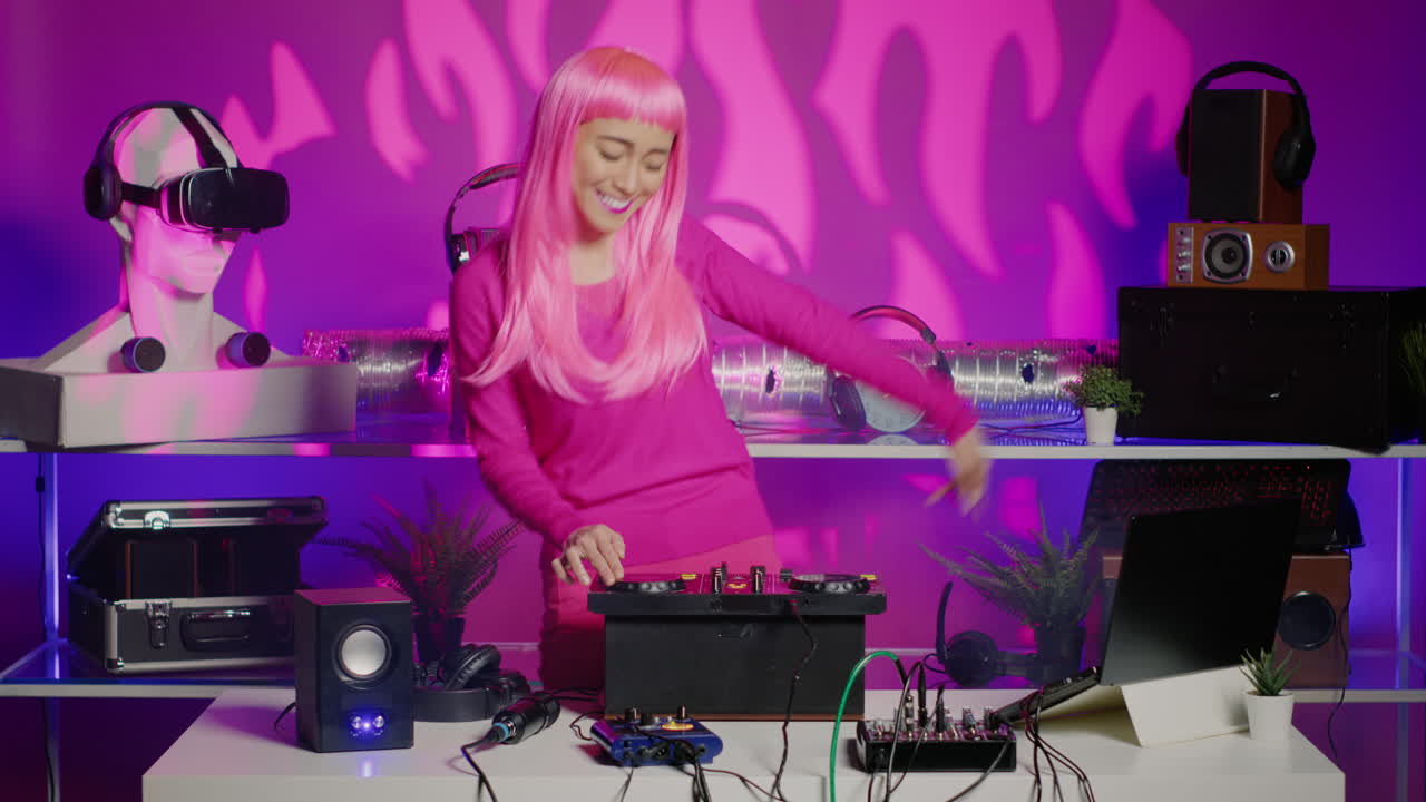 Woman DJ with Pink Wig Performing Electronic Music