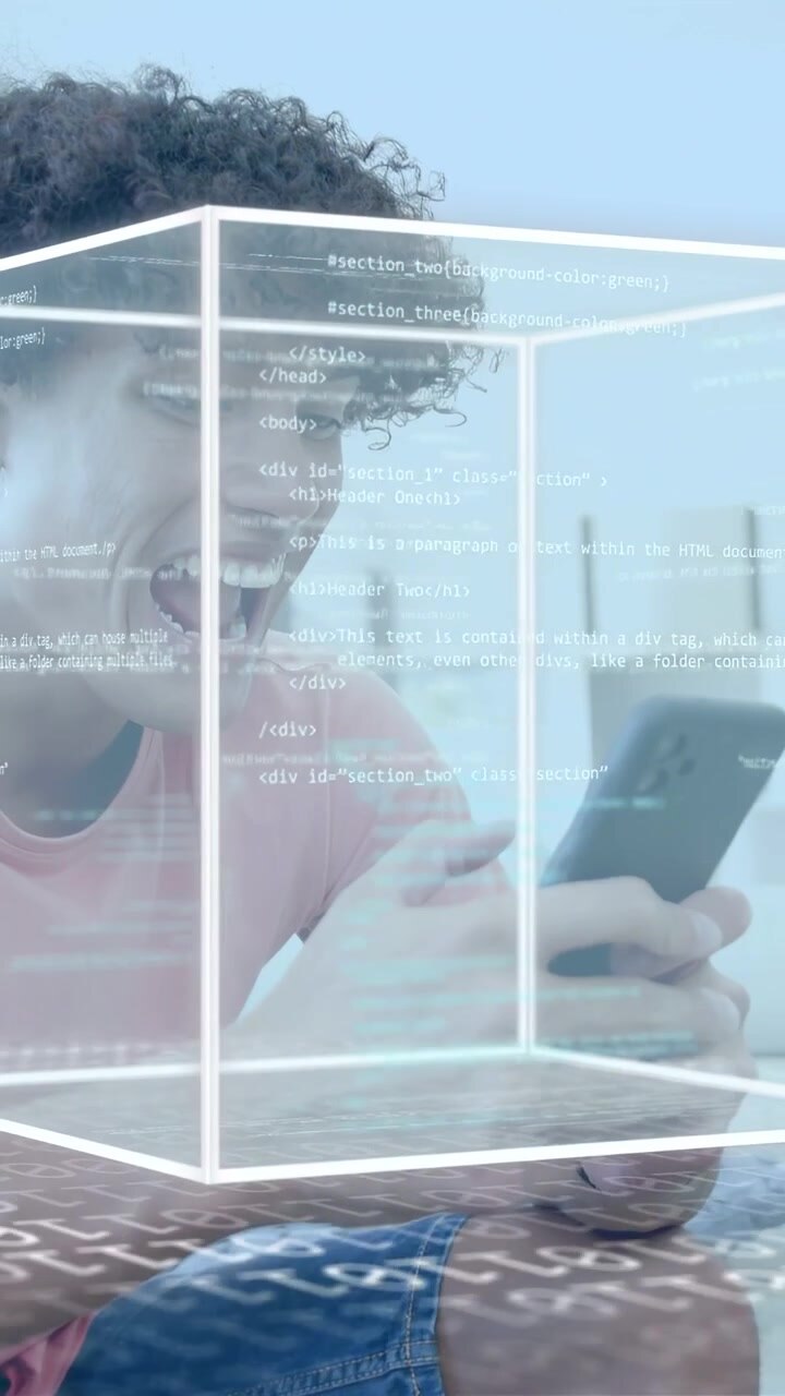 Vertical video: Man tapping smartphone on sofa, causing 3D cube overlay showing code for tech demo