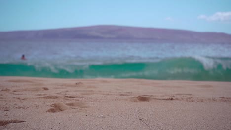 beautiful beach scene with waves and people swimming
