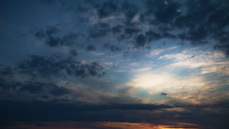 Vast-Beautiful-Sky-With-Dark-Blue-and-Orange-Background-Clouds-At-Sunset-in-4K