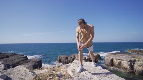 fitness exercises outdoors young fit man on the beach.