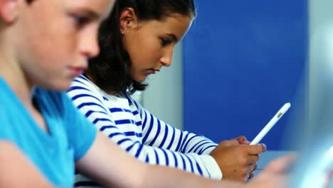 Student-using-digital-tablet-in-classroom