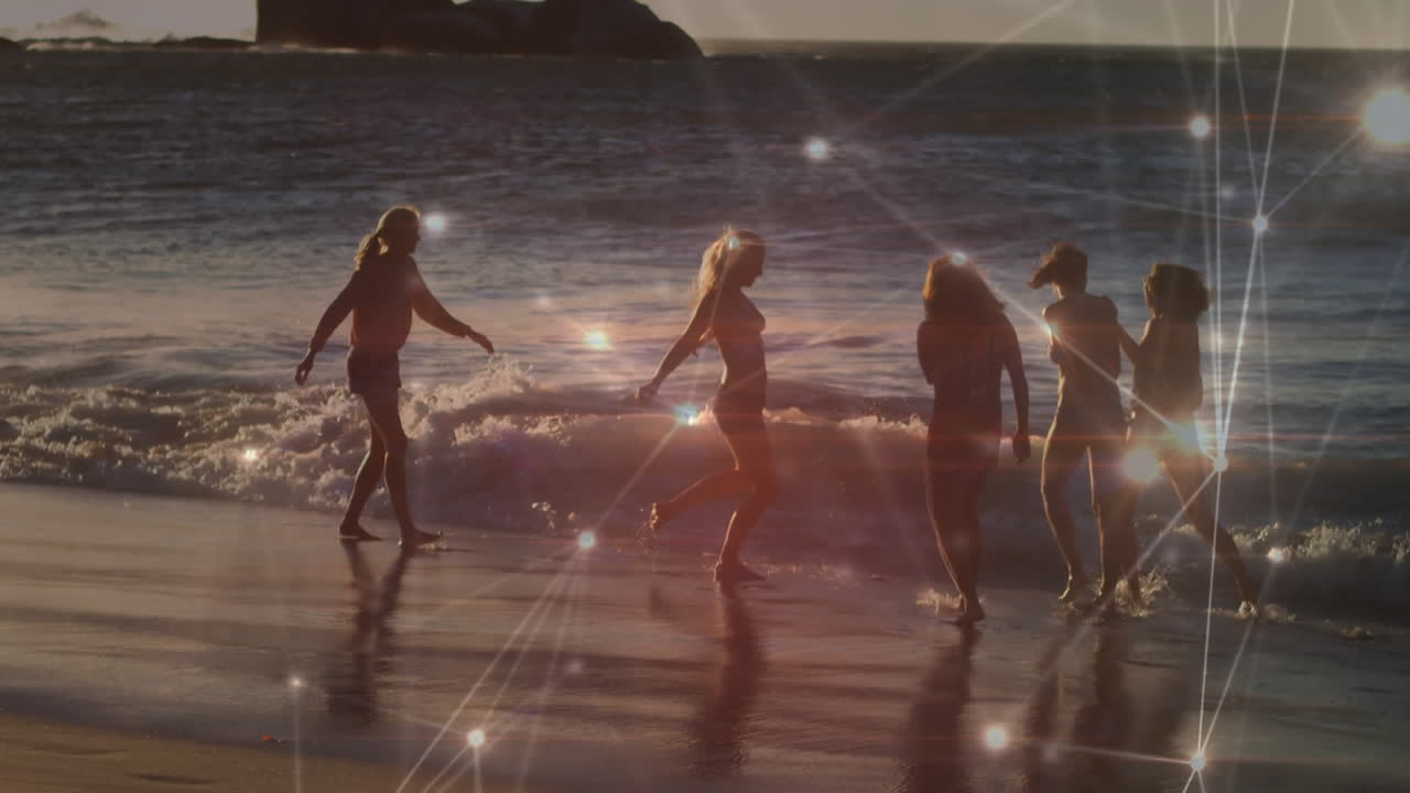 해변을 따라  ⁇ 는 즐거운 친구들의 행복한 그룹에 대한 연결 네트워크의 애니메이션