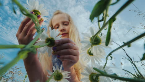 child admires wildflowers 1