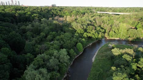 flying up fast over river with camera pan down