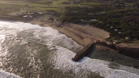 Waves-breaking-on-Luna-Roja-coast,-Chapadmalal-in-Argentina