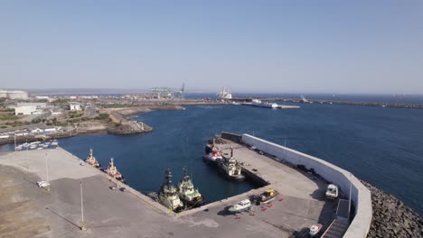 aerial establishing shot of sines industrial port on sunny day, portugal