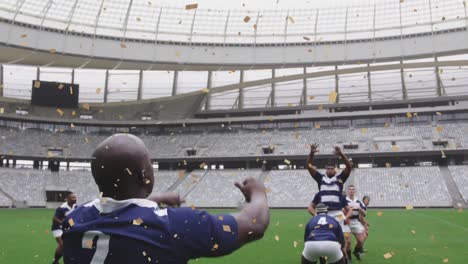 Animation-of-confetti-falling-over-diverse-male-rugby-players-at-stadium