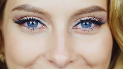 blue eyes of a young woman who is smiling