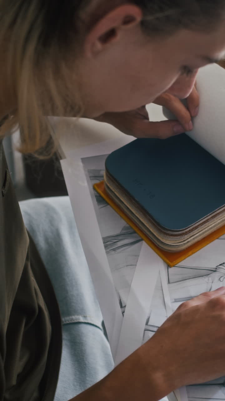 Seamster Selecting Garments and Colors for New Collection