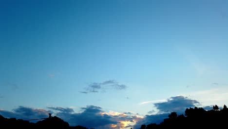 time lapse of clouds moving in blue