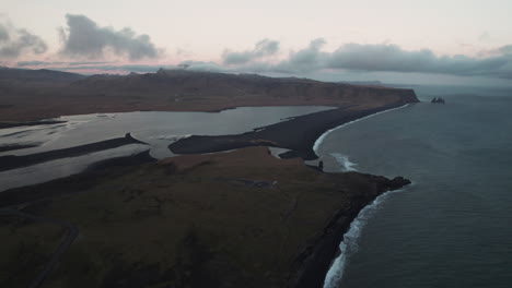 Aerial-view-over-Reynisfjara-Black-Sand-beach-in-Iceland-at-dusk