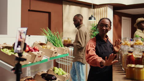 merchant creating promotional video in local farmers market