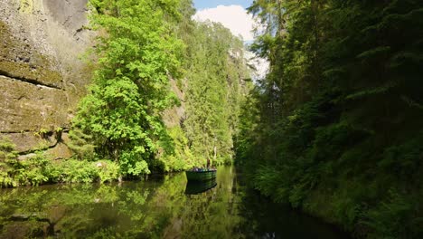 boat trip through a lush green canyon