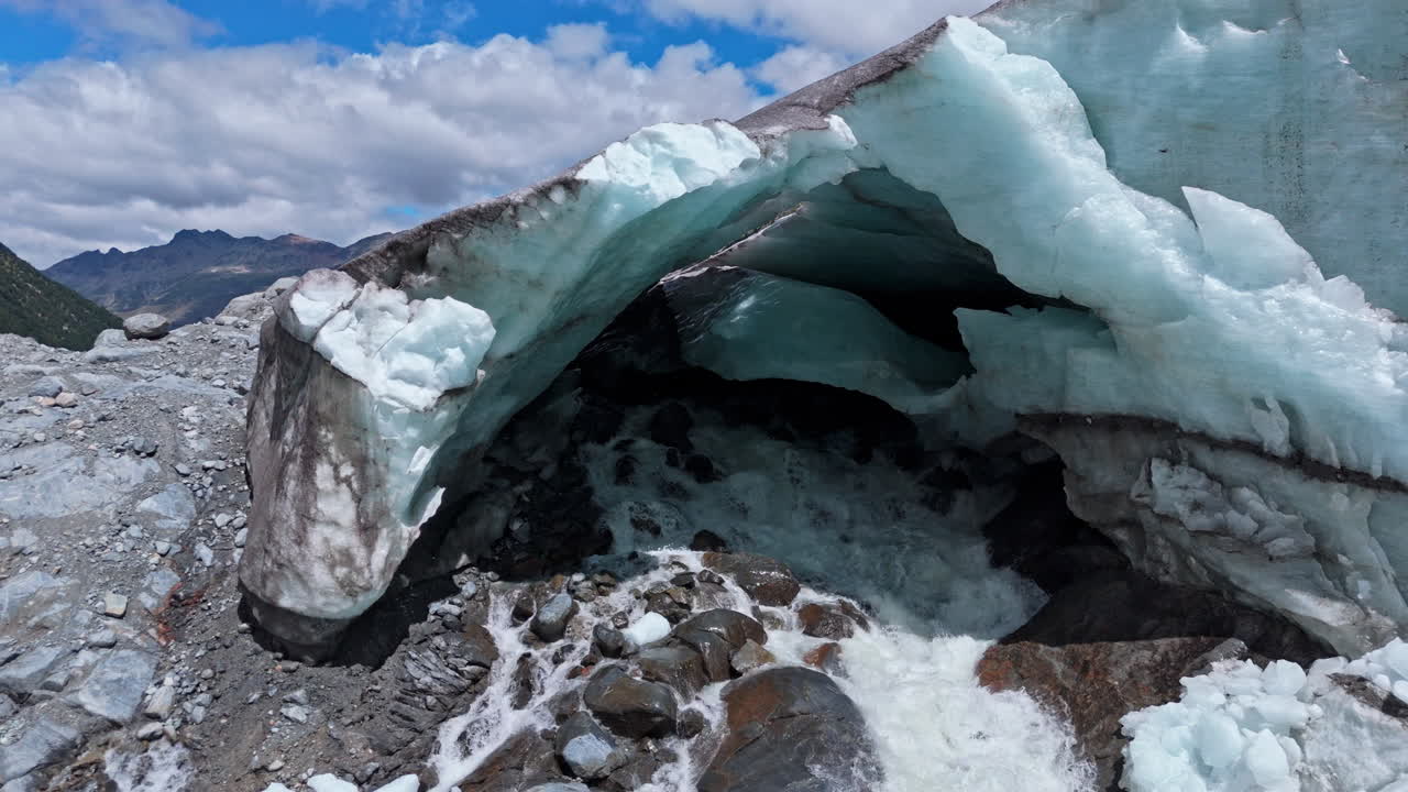Aerial view of Morteratsch Glacier showing melting ice under sunny skies