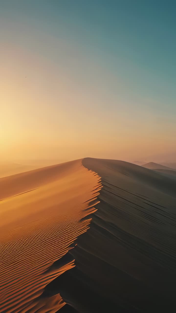 Vertical video: Camera starting forward following sand dune crest on desert ridge, showing ripples