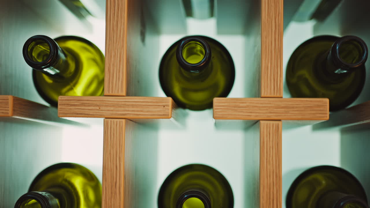 Close up of empty, green, wine bottles on a shelf
